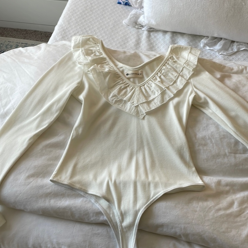 white ruffle body suit